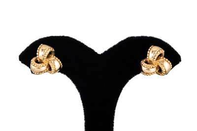 Lot 12 - A PAIR OF KNOT EARRINGS, mounted in 9ct yellow...