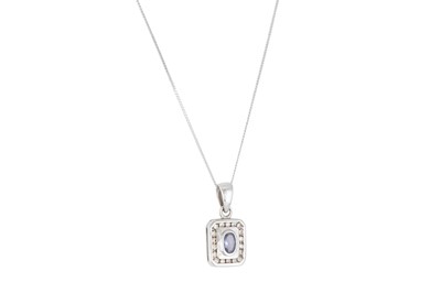 Lot 19 - A TANZANITE AND DIAMOND SET PENDANT, the...