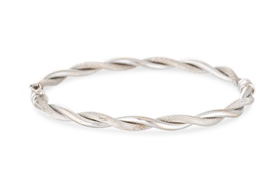 Lot 91 - A 9CT WHITE GOLD BANGLE OF TWIST FORM, gross...