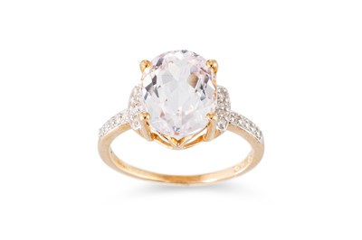 Lot 122 - A TOPAZ AND DIAMOND SET RING, the central oval...