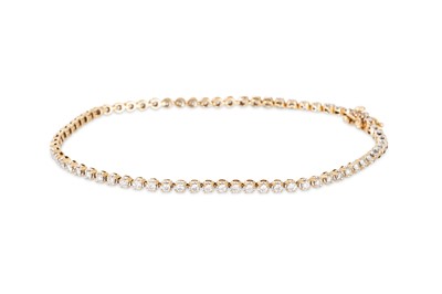 Lot 124 - A DIAMOND SET LINE BRACELET, the round cut...