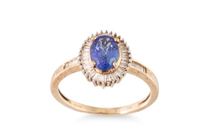 Lot 83 - A TANZANITE AND DIAMOND CLUSTER RING, mounted...