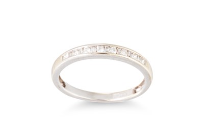 Lot 59 - A DIAMOND HALF ETERNITY RING, set with...