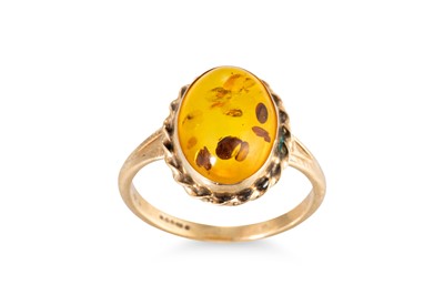 Lot 155 - AN AMBER SET DRESS RING, mounted in 9ct yellow...