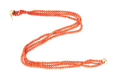 Lot 70 - A THREE-STRANDED CORAL NECKLACE, to an 18ct...