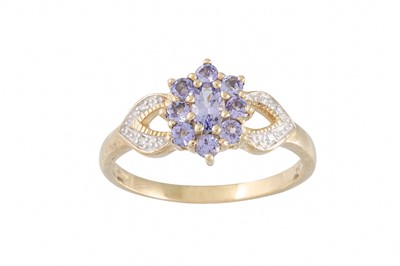 Lot 10 - A DIAMOND AND TANZANITE CLUSTER RING, with...