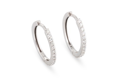 Lot 199 - A PAIR OF DIAMOND HOOP EARRINGS, the brilliant...