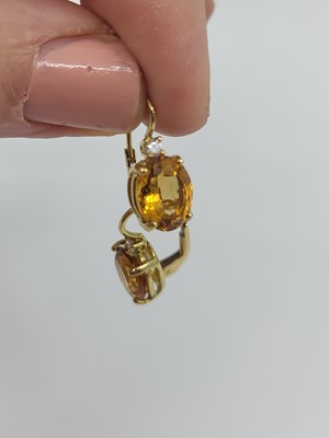 Lot 202 - A PAIR OF CITRINE AND DIAMOND EARRINGS, the...