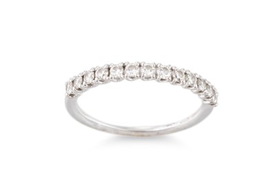 Lot 211 - A DIAMOND HALF ETERNITY RING, the brilliant...