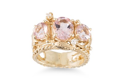 Lot 217 - A MORGANITE AND DIAMOND RING, the central oval...