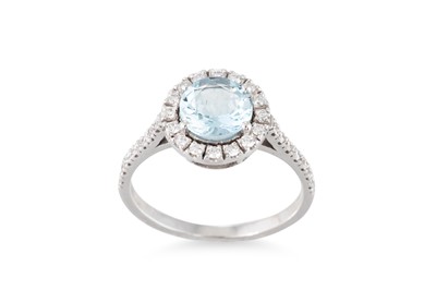 Lot 265 - AN AQUAMARINE AND DIAMOND TARGET RING, the...