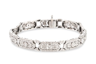 Lot 214 - AN ART DECO STYLE DIAMOND PANEL BRACELET, set...