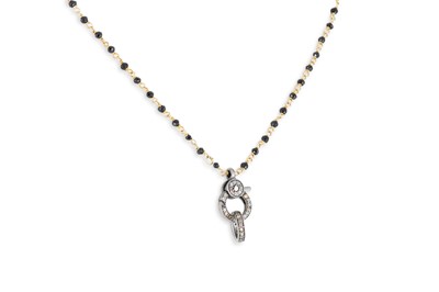Lot 2 - A GEM-SET PENDANT,  on a gem-set chain