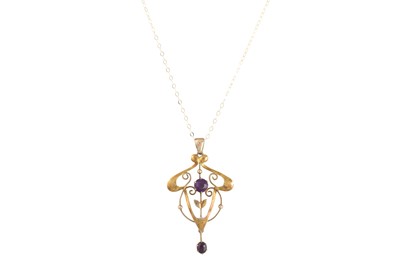 Lot 14 - AN EDWARDIAN AMETHYST SET PENDANT, mounted in...
