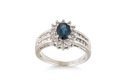 Lot 237 - A SAPPHIRE AND DIAMOND CLUSTER RING, the oval...