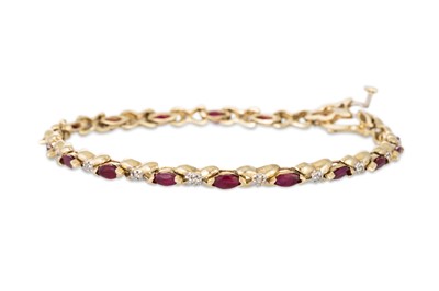 Lot 238 - A RUBY AND DIAMOND BRACELET, the oval rubies...