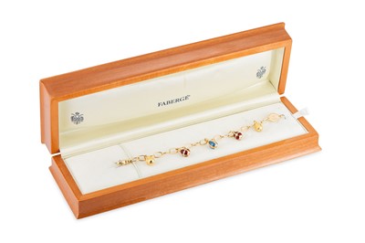 Lot 166 - A MODERN FABERGÉ 18CT YELLOW GOLD EGG CHARM...