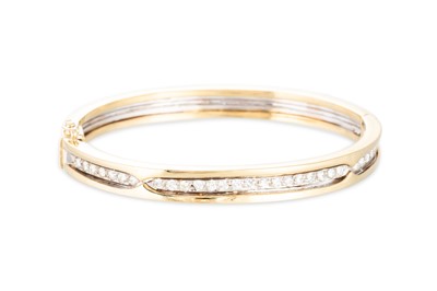 Lot 114 - A DIAMOND SET BANGLE, the round brilliant cut...