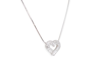 Lot 204 - A DIAMOND HEART SHAPED PENDANT, with round...