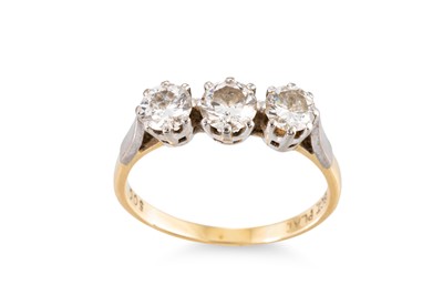 Lot 242 - A VINTAGE DIAMOND THREE STONE RING, the round...