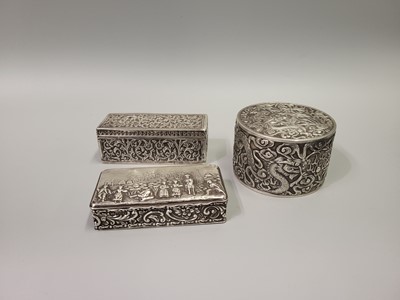 Lot 515 - THREE HEAVILY EMBOSSED SILVER BOXES, one...