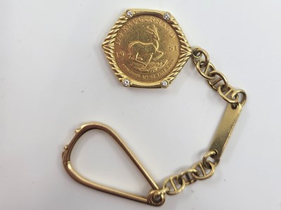 Lot 504 - A 1981 1/4 OZ FINE GOLD KRUGERRAND, mounted as...