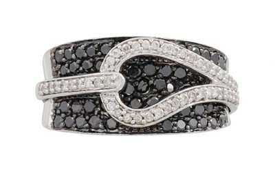 Lot 26 - A BLACK AND WHITE DIAMOND DRESS RING, pavé set...