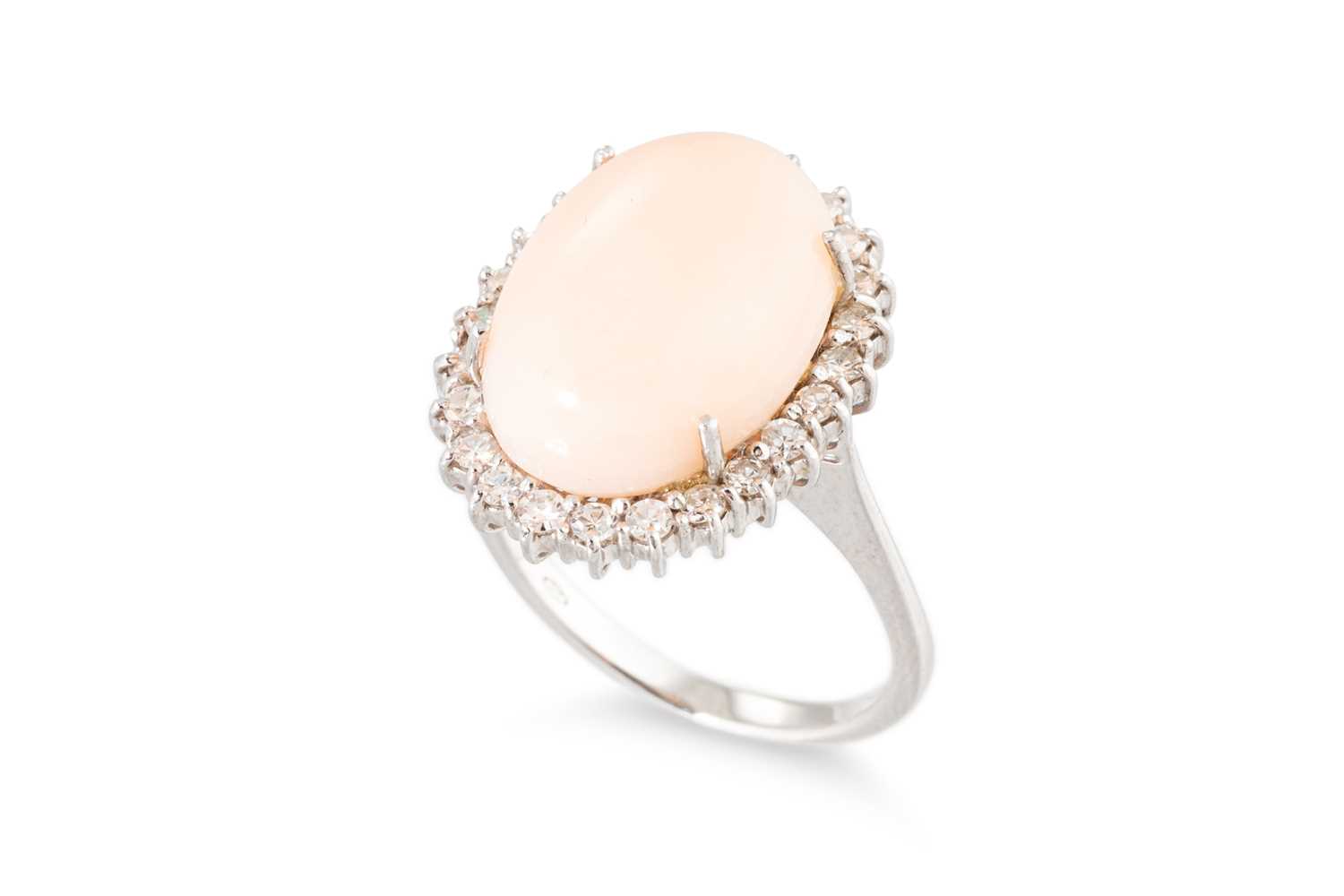 Lot 193 - A CORAL AND DIAMOND SET CLUSTER RING, the...
