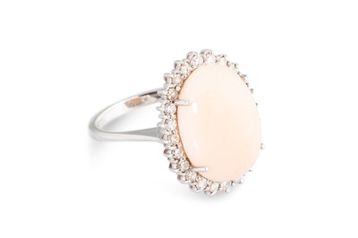 Lot 193 - A CORAL AND DIAMOND SET CLUSTER RING, the...