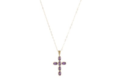 Lot 45 - AN AMETHYST CROSS, mounted in 9ct yellow gold,...