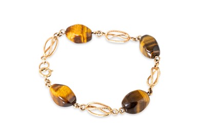 Lot 7 - A 9CT GOLD AND TIGER'S EYE SET BRACELET, the...