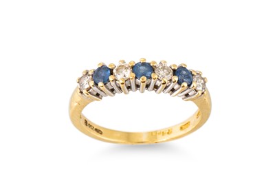 Lot 118 - A DIAMOND AND SAPPHIRE SEVEN STONE BAND RING,...