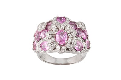 Lot 180 - A PINK SAPPHIRE AND DIAMOND CLUSTER RING, of...