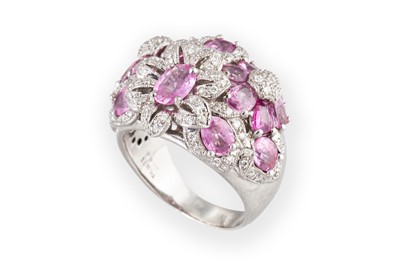 Lot 180 - A PINK SAPPHIRE AND DIAMOND CLUSTER RING, of...