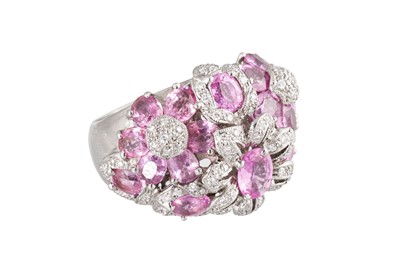 Lot 180 - A PINK SAPPHIRE AND DIAMOND CLUSTER RING, of...
