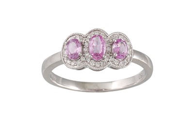 Lot 47 - A DIAMOND AND PINK SAPPHIRE DRESS RING,...