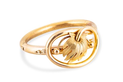 Lot 41 - A VICTORIAN GOLD PLATED SHAPED BANGLE, of...