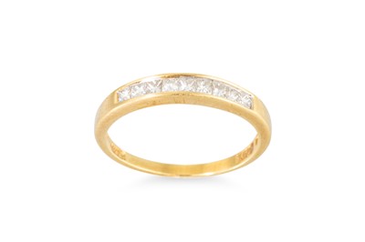 Lot 196 - A HALF ETERNITY RING, channel set princess cut...