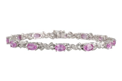 Lot 50 - A DIAMOND AND PINK GEM SET BRACELET, the...