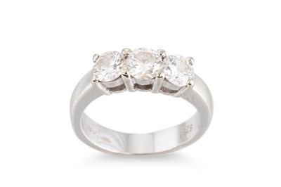 Lot 324 - A DIAMOND THREE-STONE RING, the round...