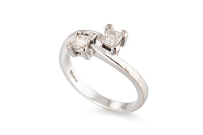 Lot 146 - A DIAMOND TWO-STONE RING, the toi et moi dress...