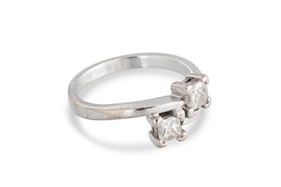 Lot 146 - A DIAMOND TWO-STONE RING, the toi et moi dress...
