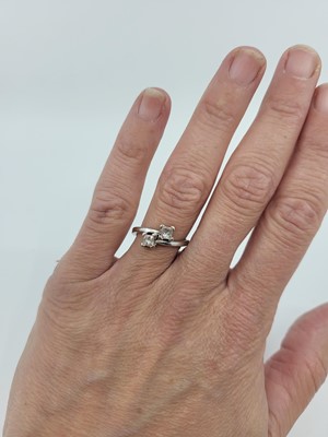 Lot 146 - A DIAMOND TWO-STONE RING, the toi et moi dress...