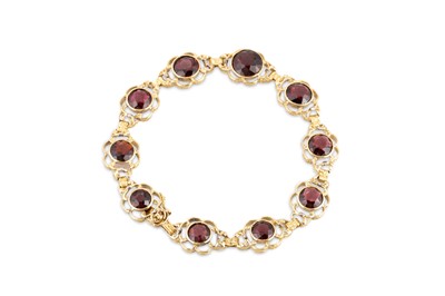 Lot 138 - A GARNET BRACELET, the circular stones set to...