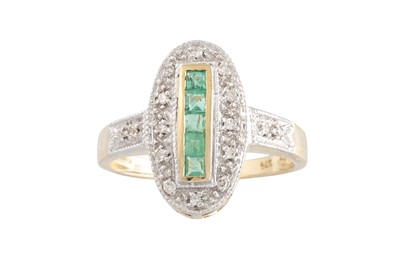 Lot 63 - A DIAMOND AND EMERALD OVAL SHAPED RING, the...