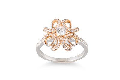 Lot 111 - A DIAMOND SET CLUSTER RING, unusual openwork...