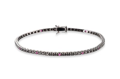 Lot 112 - A BLACK DIAMOND AND RUBY LINE BRACELET,...