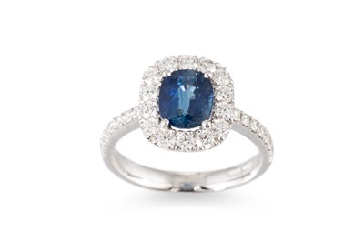 Lot 182 - A SAPPHIRE AND DIAMOND CLUSTER RING, the oval...