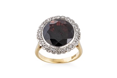 Lot 65 - A DIAMOND AND GARNET SET CLUSTER RING, the...