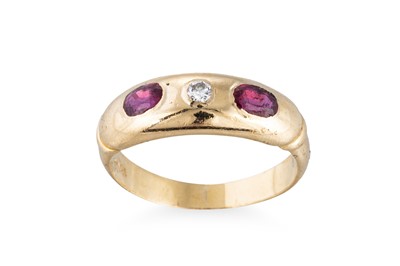 Lot 69 - A DIAMOND AND RUBY THREE-STONE  BOMBÉ RING,...